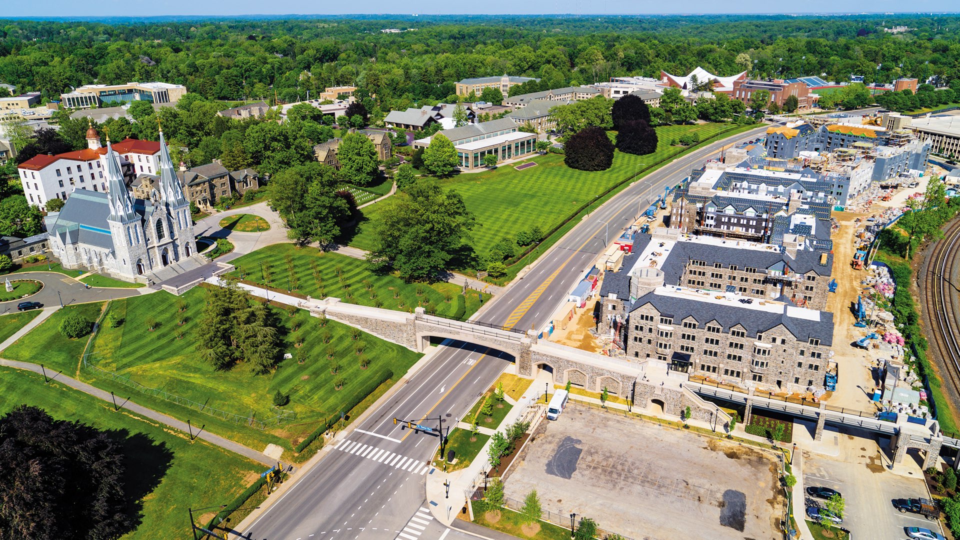 Aerial shot of Lancaster Avenue showing the chapel, main campus, and bridge with new residence halls under construction