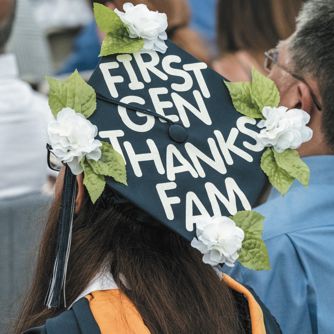 Cap with white flowers that reads “First Gen Thanks Fam”