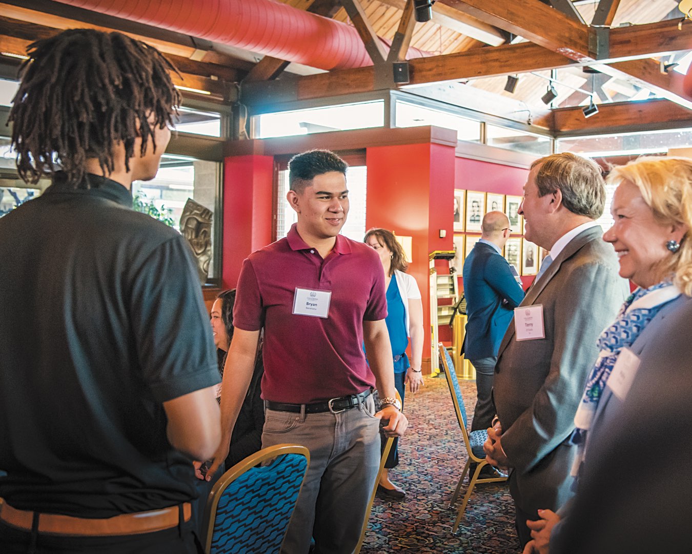 Polly and Terry O’Toole talking with incoming O’Toole Scholars Jonathan Marte and Bryan Barahona at the O’Toole Luncheon
