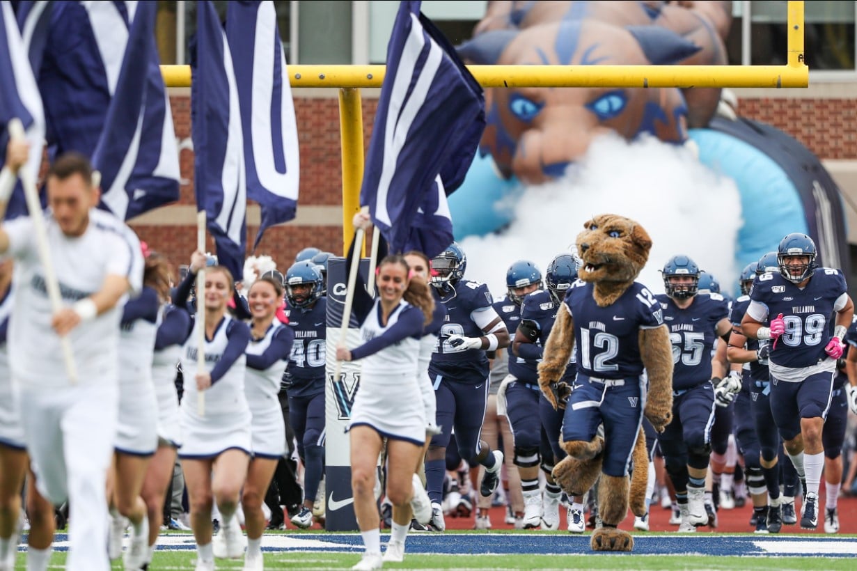Homecoming Villanova Cheerleaders, Wil D. Cat and Football Players running onto the field at Villanova Stadium