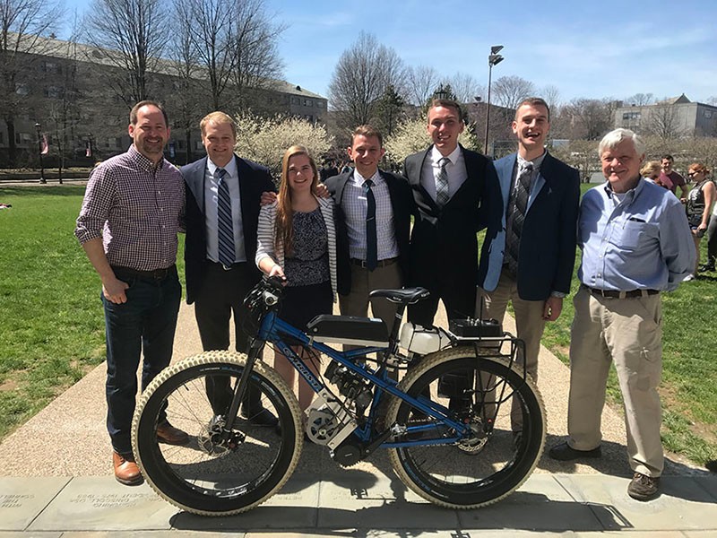 Senior Mechanical Engineers worked on a fatbike for Christini Technologies Senior Mechanical Engineers posing with fatbike
