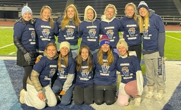 Female students posing for soccer champion photo