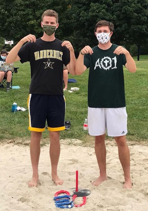 Three male students posing for horseshoes champs photo
