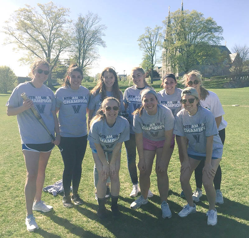 Female students posing for softball champion photo