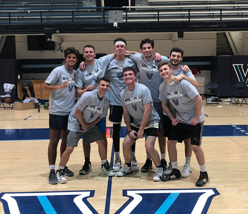 Male students posing for basketball champion photo