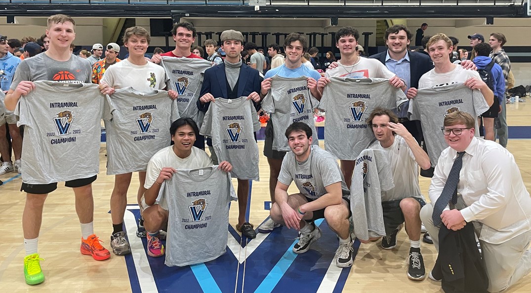 Male students posing for basketball champion photo