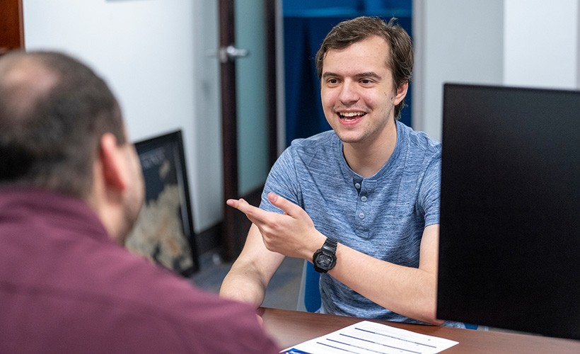 A student meets with the Director of Professional Development.