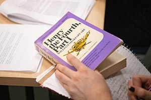 English-major A student takes notes while reading "Henry the Fouth, Part 1"