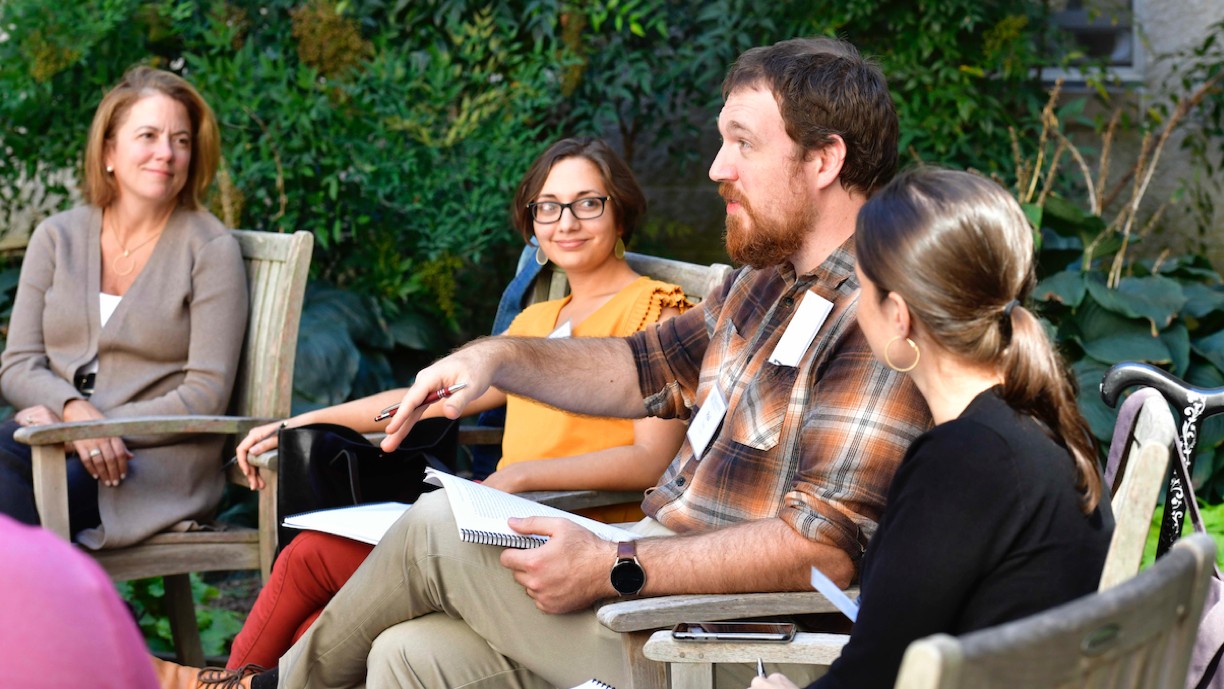 Three alumni speaking with Dr. Anna Moreland Three alumni speaking with Dr. Anna Moreland in September 2023
