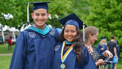 Completion Rates Two Villanova MPA students in graduation caps and gowns