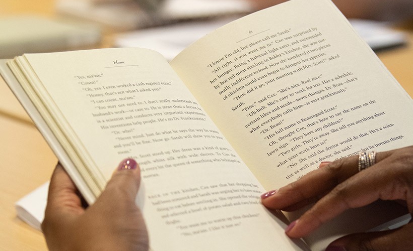 Peace and Justice courses Close up of an individual reading a book.