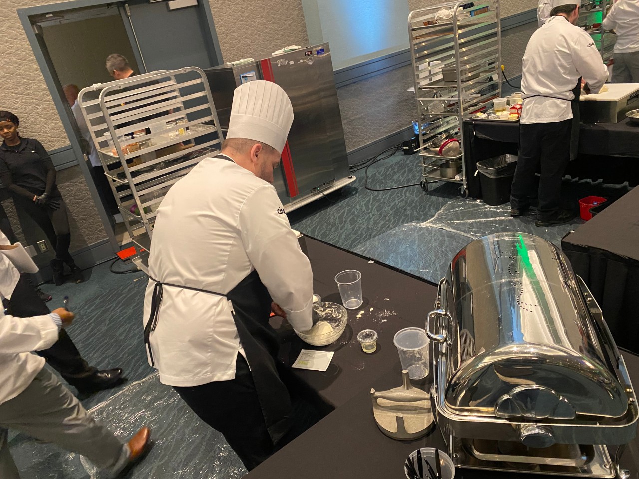 Chef Christopher Wiseley prepares his dish at the 2025 NACUFS Culinary Challenge. Chef Christopher Wiseley prepares his dish at the 2025 NACUFS Culinary Challenge.