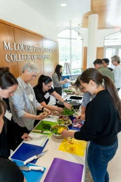 Culinary Med 101-Group at table-FCN Sign Culinary Med 101-Group at table-FCN Sign