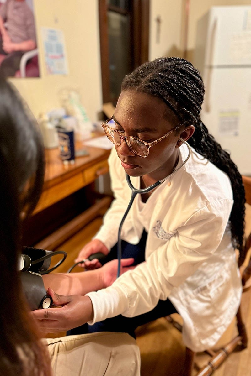 unity-clinic-1 A student volunteer taking vitals