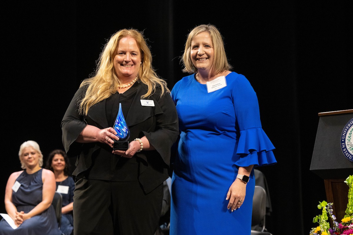 Meredith Okenquist receives her award Meredith Okenquist receives her award