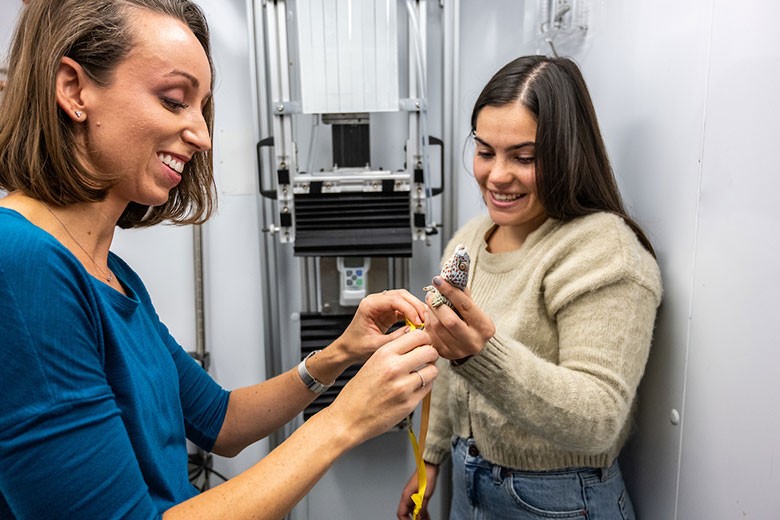 Alyssa Stark and student holding gecko