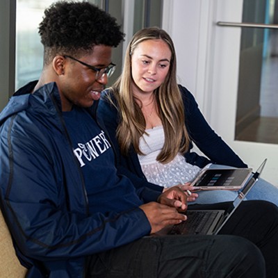 students looking at a laptop