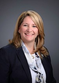 headshot of woman with blouse and jacket