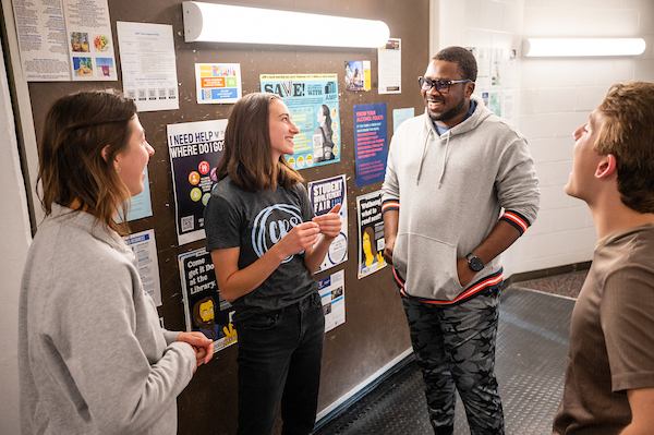 Students chatting in a hallway