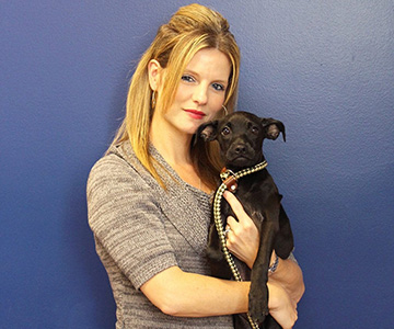 Jen Villalobos with a puppy
