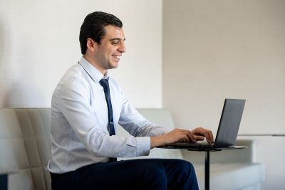 man working on a laptop in an office