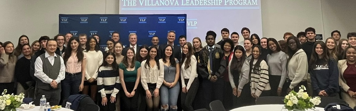 A group of students attends a Villanova Leadership Program awards dinner