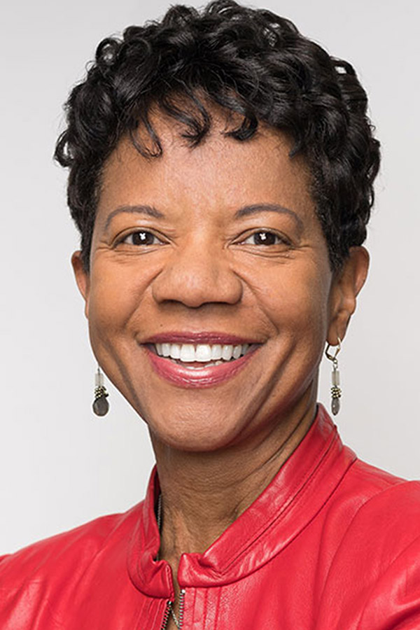 headshot of Lillian Dukes wearing a red leather jacket