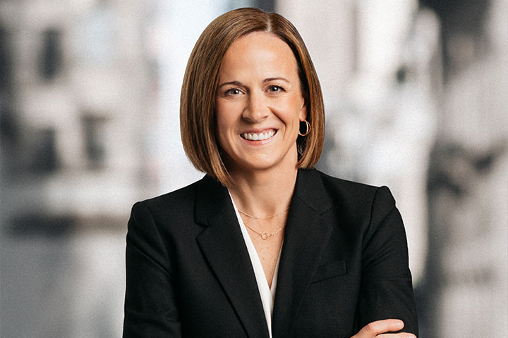 headshot of Christine Dorfler standing with her arms crossed