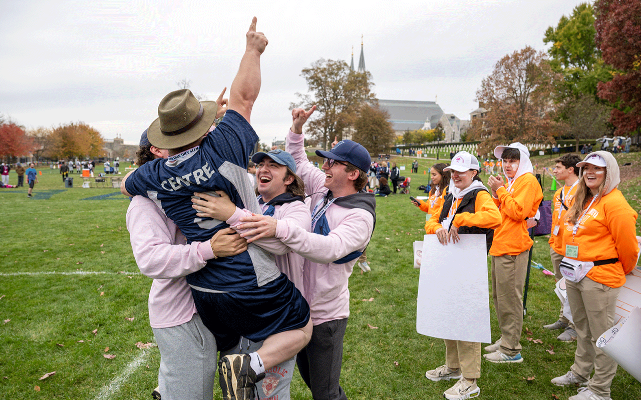 Villanova students volunteering at the Special Olympics Fall Festival cheer on an athlete
